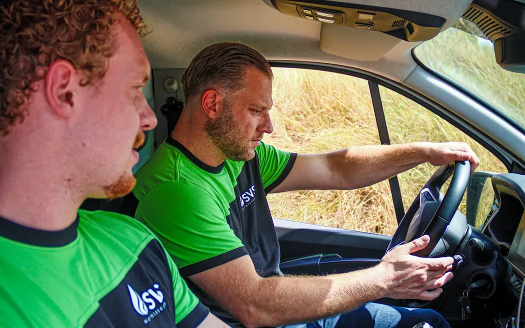 Two SVS Warmteservice engineers on their way to a call-out in the service van.